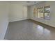 Bright and airy spare bedroom with tile floors and large windows at 3576 N Carlton St, Buckeye, AZ 85396
