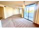 Bright living room with carpet, ceiling fan, and sliding glass door to balcony at 3848 N 3Rd Ave # 2054, Phoenix, AZ 85013