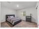 Bedroom with a double bed and gray dresser at 442 W Black Hawk Pl, Casa Grande, AZ 85122