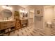 Modern bathroom with dual vanities, a toilet, and access to a walk-in closet at 4713 N Brookview Ter, Litchfield Park, AZ 85340