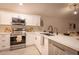 Stylish kitchen with stainless steel appliances and white cabinets at 4713 N Brookview Ter, Litchfield Park, AZ 85340