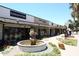 Exterior view of shops and businesses with a central fountain at 5170 N 83Rd St, Scottsdale, AZ 85250