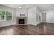 Living room with corner fireplace and wood floors at 8787 E Mountain View Rd # 2021, Scottsdale, AZ 85258