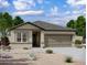 One-story home with a two-car garage and desert landscaping at 9714 W Agora Ln, Tolleson, AZ 85353