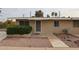 Tan exterior building with a walkway and landscaping at 10456 W Oakmont Dr, Sun City, AZ 85351