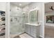Modern bathroom with a walk-in shower and gray vanity at 115 S Galaxy Dr, Chandler, AZ 85226
