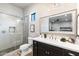 Spa-like bathroom with a walk-in shower and modern vanity at 115 S Galaxy Dr, Chandler, AZ 85226