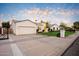 Beautiful home with a two-car garage and well-maintained landscaping at 115 S Galaxy Dr, Chandler, AZ 85226