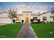 Modern house with a welcoming entrance and landscaped yard at 115 S Galaxy Dr, Chandler, AZ 85226