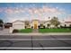 Stunning single-story home with a manicured lawn and walkway at 115 S Galaxy Dr, Chandler, AZ 85226