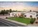 Stunning single-story home with a beautifully landscaped lawn and driveway at 115 S Galaxy Dr, Chandler, AZ 85226
