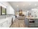 Open concept kitchen with granite countertops, stainless steel appliances, and an island at 115 S Galaxy Dr, Chandler, AZ 85226