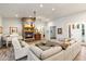 Spacious living room with a cozy fireplace and ample seating at 115 S Galaxy Dr, Chandler, AZ 85226