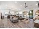 Open living area with a sectional sofa, a fireplace, and access to the backyard at 115 S Galaxy Dr, Chandler, AZ 85226
