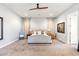 Luxurious main bedroom with a king-size bed and lots of natural light at 115 S Galaxy Dr, Chandler, AZ 85226