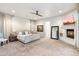 Spacious main bedroom with a fireplace, large bed and access to backyard at 115 S Galaxy Dr, Chandler, AZ 85226