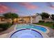 Inviting backyard oasis featuring a sparkling pool and spa at 115 S Galaxy Dr, Chandler, AZ 85226