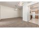 Bright dining area with a stained glass light fixture and neutral carpet at 11937 N 110Th Way, Scottsdale, AZ 85259