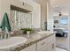 Double sink bathroom with granite countertop and shower at 125 N Val Vista Rd, Apache Junction, AZ 85119