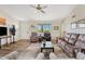 Living room with comfortable seating, a large TV, and tile floors at 125 N Val Vista Rd, Apache Junction, AZ 85119