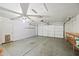 Garage with overhead door and storage shelving at 13253 W Paradise Ln, Surprise, AZ 85374