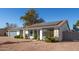 House exterior with solar panels, attached garage, and a well-maintained yard at 14410 N 42Nd Pl, Phoenix, AZ 85032