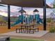 Playground with shaded seating and play structures at 16038 W Desert Hollow Dr, Surprise, AZ 85387