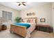 Bedroom with wooden bed frame and southwestern decor at 16938 W Desert Rose Ln, Surprise, AZ 85387