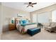 Spacious bedroom with a king-size bed and large windows at 16938 W Desert Rose Ln, Surprise, AZ 85387