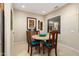 Cozy breakfast nook with round table and teal chairs at 16938 W Desert Rose Ln, Surprise, AZ 85387