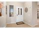 Bright and airy entryway with tile flooring at 16938 W Desert Rose Ln, Surprise, AZ 85387