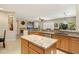 Open concept kitchen with granite island and breakfast bar at 16938 W Desert Rose Ln, Surprise, AZ 85387