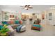 Open concept living room, kitchen, and dining area at 16938 W Desert Rose Ln, Surprise, AZ 85387