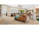 Spacious living room with comfortable seating and a view of the kitchen at 16938 W Desert Rose Ln, Surprise, AZ 85387