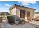 Relaxing patio area with seating and desert plants at 16938 W Desert Rose Ln, Surprise, AZ 85387