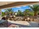 Relaxing patio with built-in grill, stone accents, and seating area at 16938 W Desert Rose Ln, Surprise, AZ 85387