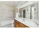 Bathroom with tub, vanity, and large mirror at 2064 S Farnsworth Dr # 39, Mesa, AZ 85209