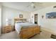 Bedroom with wood bed frame, nightstand, and ceiling fan at 2064 S Farnsworth Dr # 39, Mesa, AZ 85209