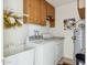 Laundry room with washer, dryer, cabinets, and utility sink at 2064 S Farnsworth Dr # 39, Mesa, AZ 85209
