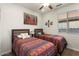 Bedroom with two twin beds and colorful bedding at 20729 N 262Nd Dr, Buckeye, AZ 85396