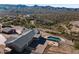 Aerial view of house, pool, and desert landscape at 22765 N Rayo De Sol Ct, Kearny, AZ 85137