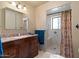 Bathroom with granite countertop, wood vanity, and walk-in shower at 22765 N Rayo De Sol Ct, Kearny, AZ 85137