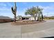 Desert landscape property with circular driveway and cacti at 22765 N Rayo De Sol Ct, Kearny, AZ 85137