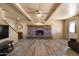 Living room with brick fireplace and laminate flooring at 22765 N Rayo De Sol Ct, Kearny, AZ 85137