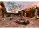 Charming courtyard with fountain, fire pit, and string lights at 30316 N 139Th St, Scottsdale, AZ 85262