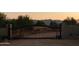 Ornate metal gate opens to a private drive and beautiful mountain views at 30316 N 139Th St, Scottsdale, AZ 85262