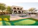 Stunning home exterior with a pool, putting green, and mountain views at 30316 N 139Th St, Scottsdale, AZ 85262