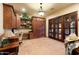 Home office with built-in wooden cabinets and a desk at 30316 N 139Th St, Scottsdale, AZ 85262