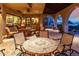 Relaxing patio seating area with a stone table and chairs at 30316 N 139Th St, Scottsdale, AZ 85262