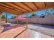 Relaxing patio with terracotta tile flooring and shade sail at 3443 E Tonto Ln, Phoenix, AZ 85050